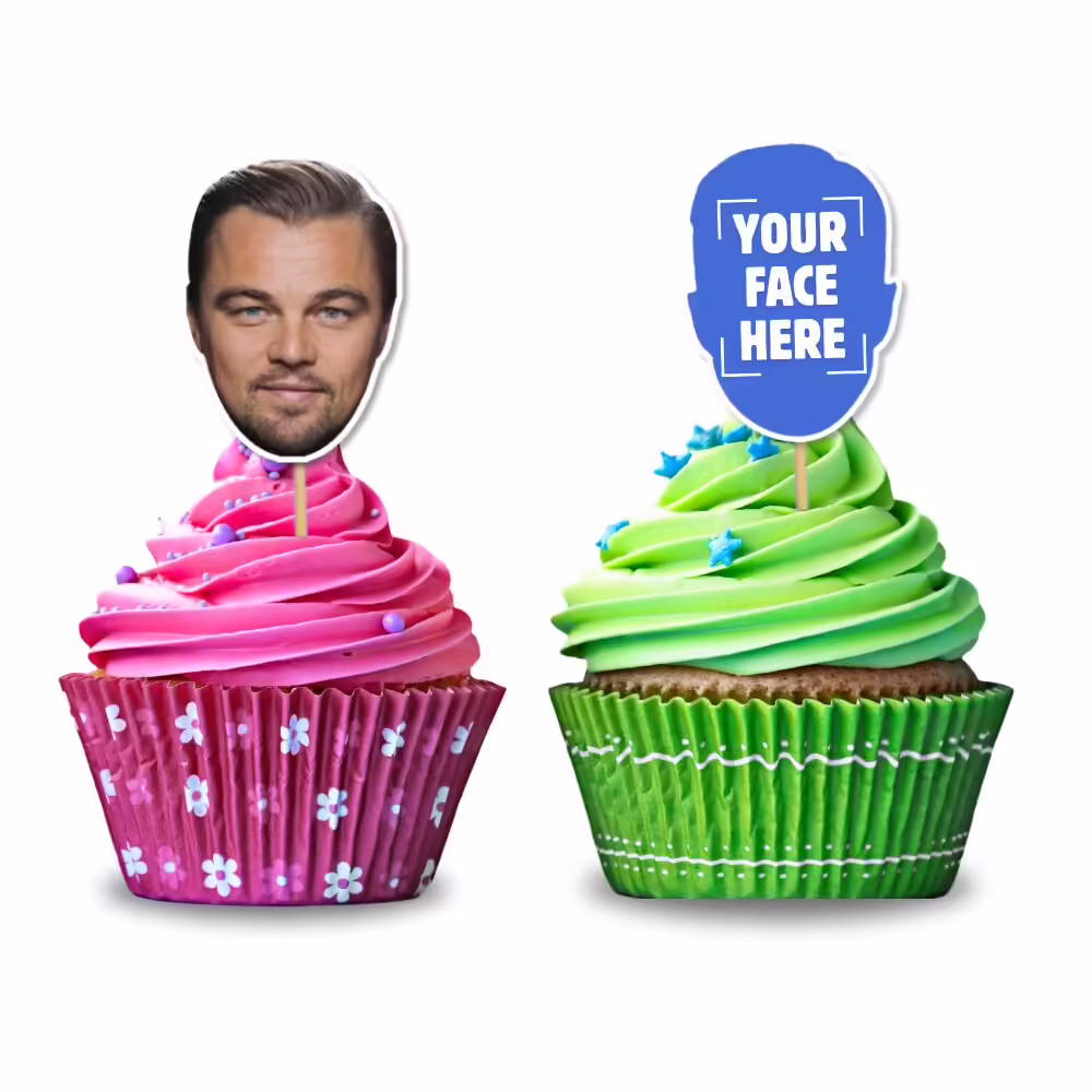 Two cupcakes with personalised toppers featuring faces, one pink cupcake and one green cupcake