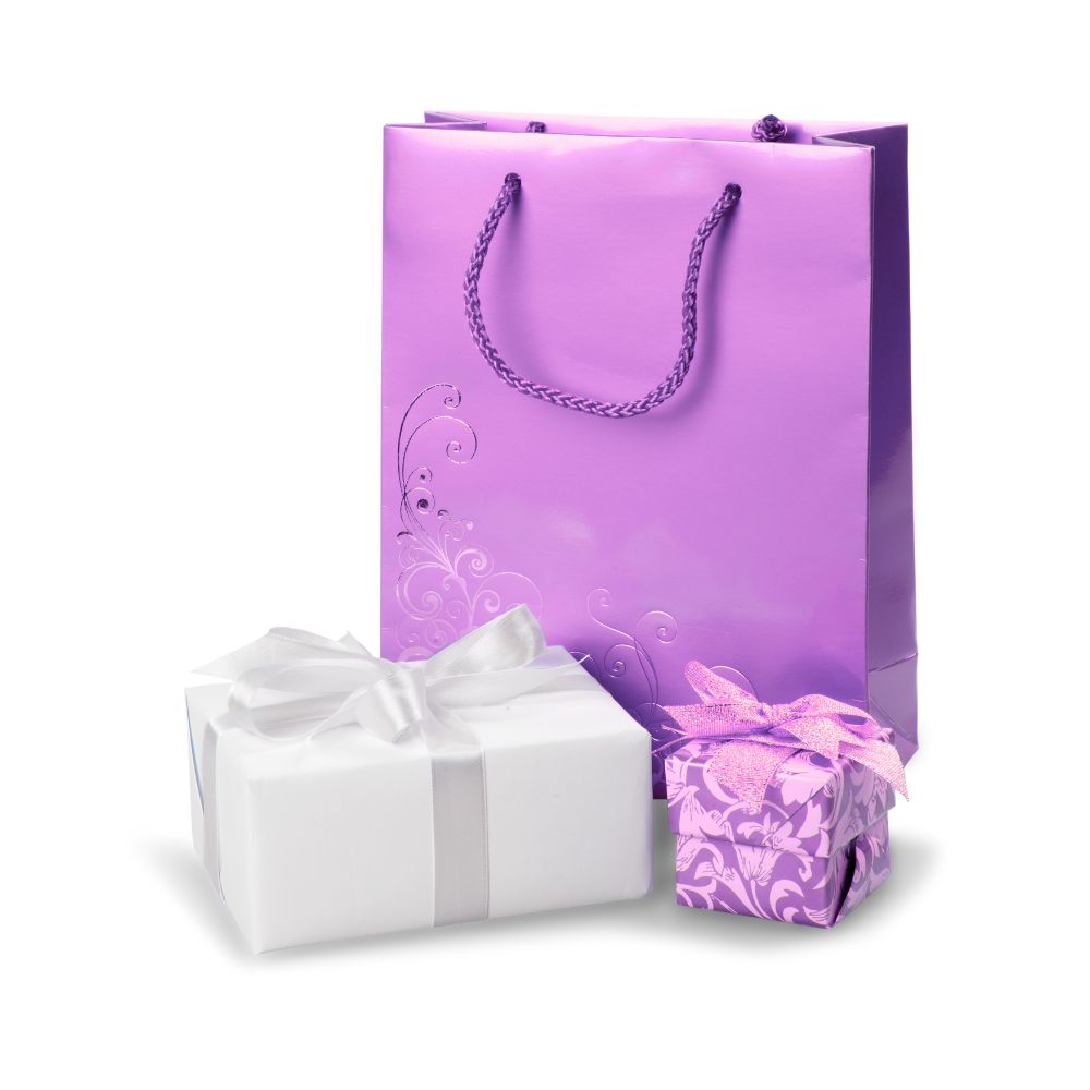 Purple and white gift bags representing personalised face straws as party favours